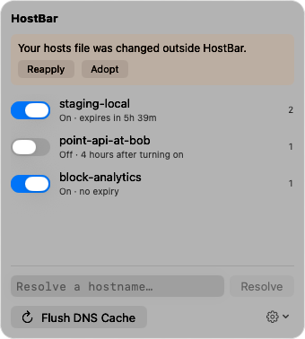 The popover with a banner: Your hosts file was changed outside HostBar, with Reapply and Adopt buttons, above the three profiles.